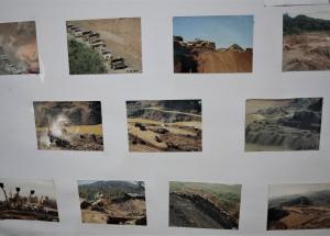 At KDNG’s offices, posters display photos of natural resource megaprojects and some of the impacts that they have on local communities and the environment.